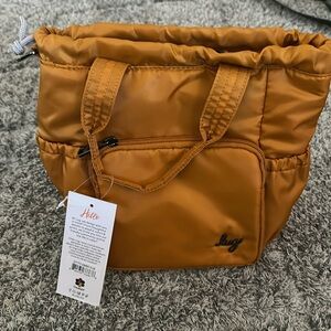 Lug Ditty bag, does not come with strap.  New with tag, smoke free.